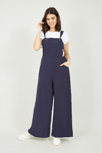 Image of a model wearing a navy dungaree jumpsuit